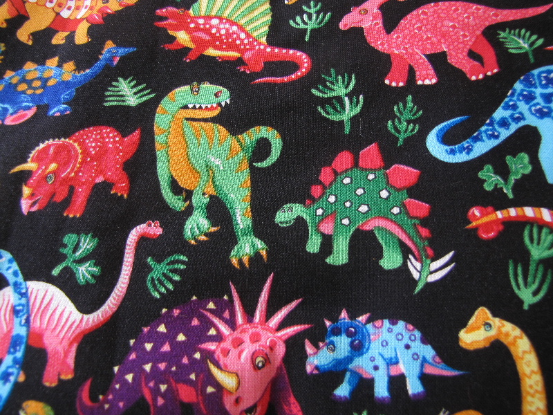 Bright Coloured Dinosaurs on a Black Background - Click Image to Close
