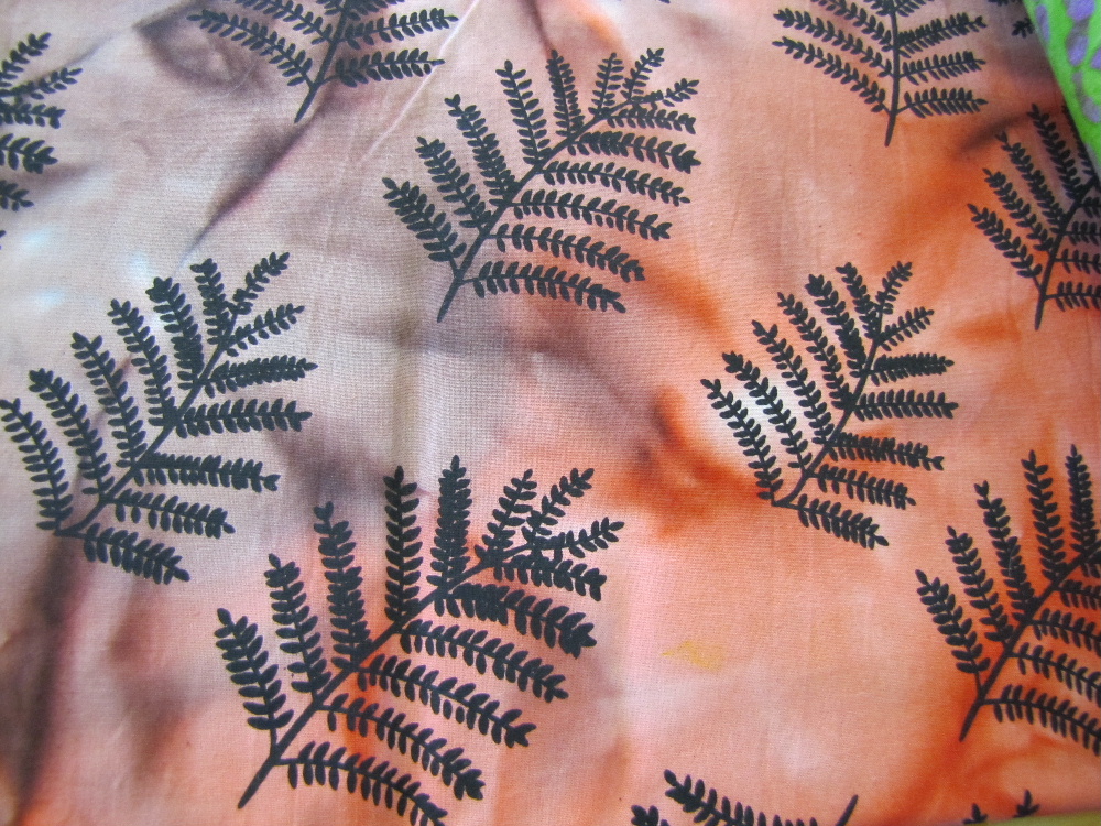 Batik - Browns, Orange, Red with Black Imprint of Leaf Fronds - Click Image to Close